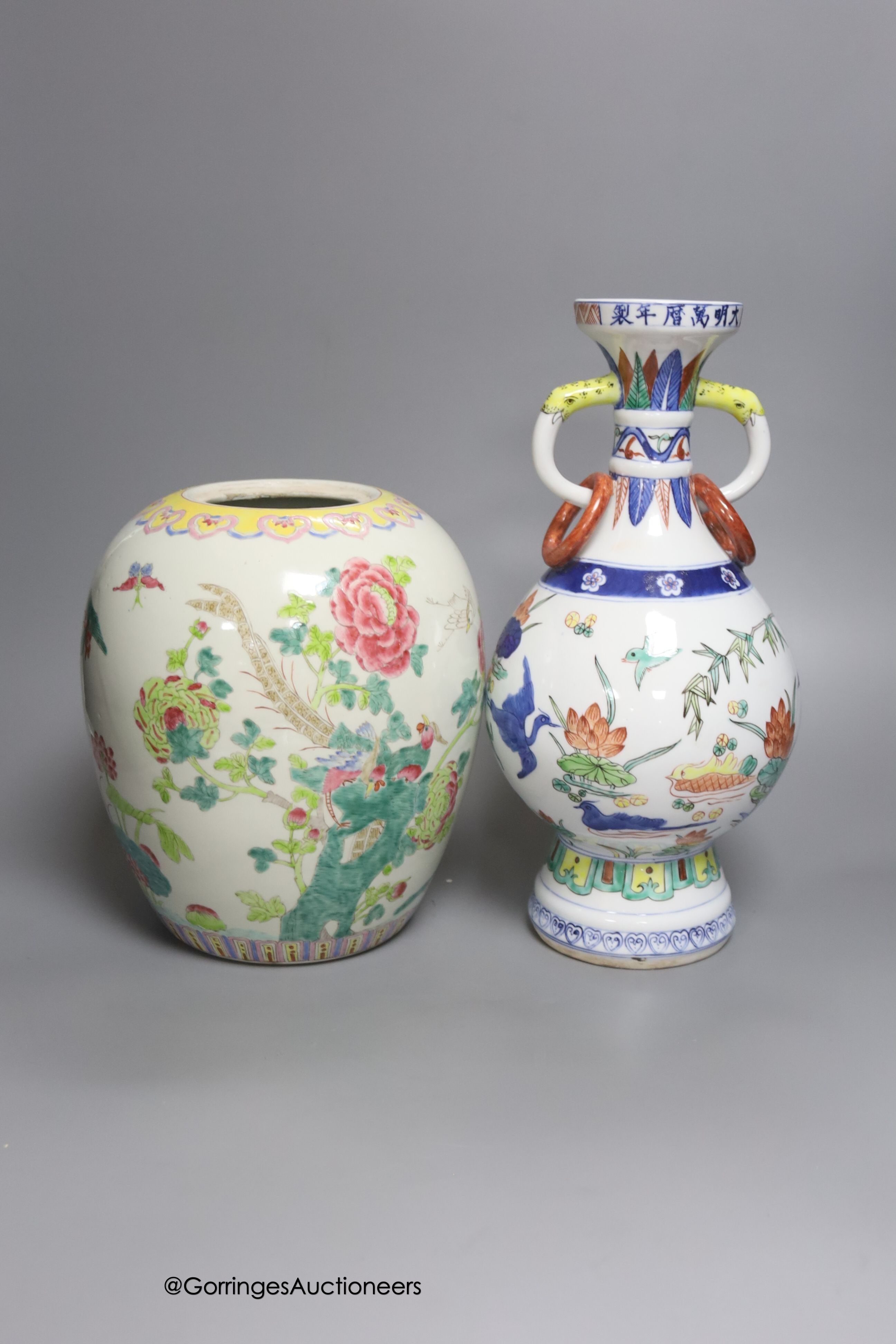 A Chinese famille rose jar and a polychrome vase, tallest 31cm